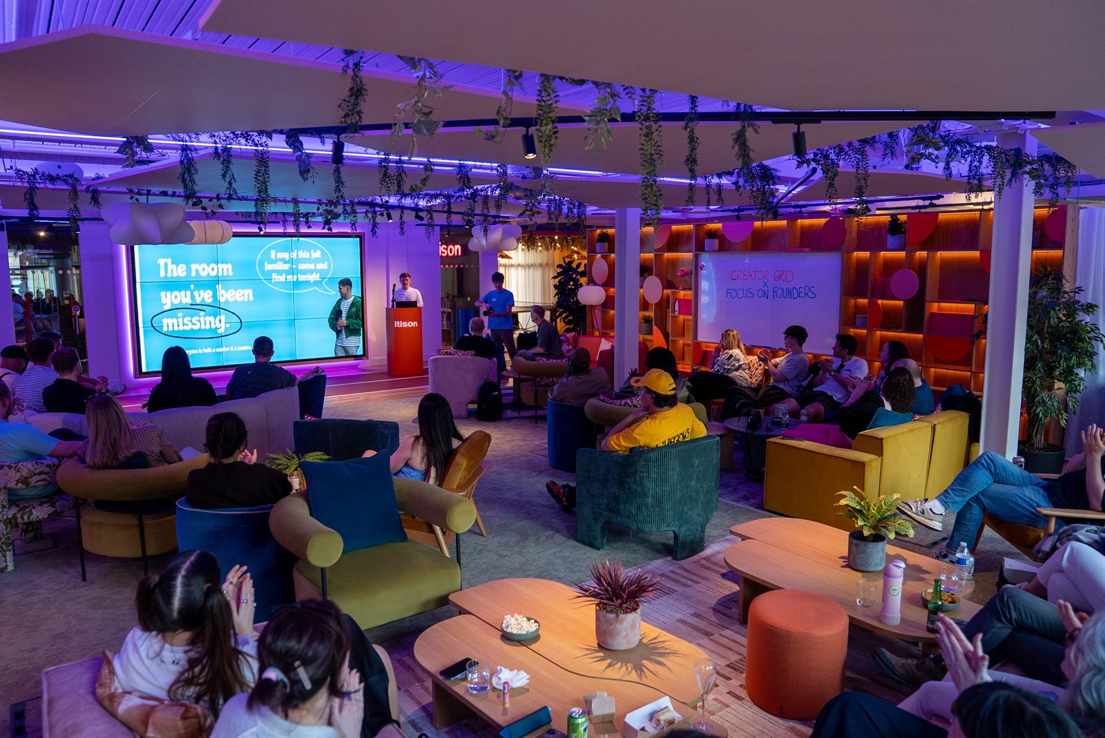 A full room of founders at a Focus on Founders event in Glasgow, with a screen reading The room you have been missing